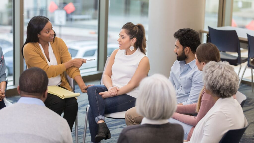 Diverse mental health professionals in a seminar setting