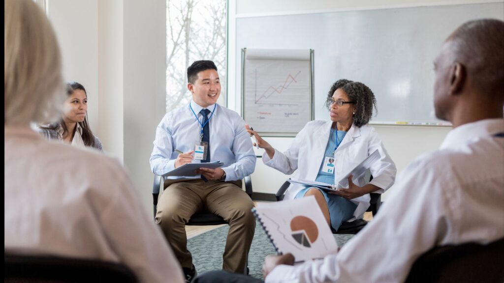 A professional, diverse group of mental health professionals in discussion